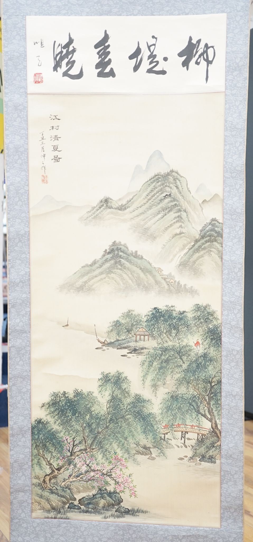 A late 19th century hand scroll and three other scroll paintings